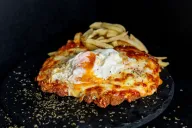 Milanesa a la napolitana a caballo